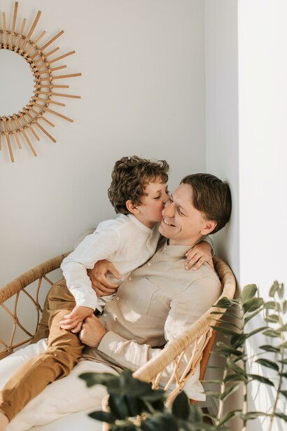 A father and son sat together. A parent-child relationship is always wonderful