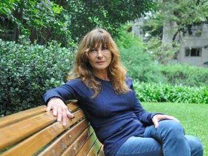 As she sits surrounded by nature, Labayru embodies resilience, confronting the shadows of history while embracing the possibility of renewal