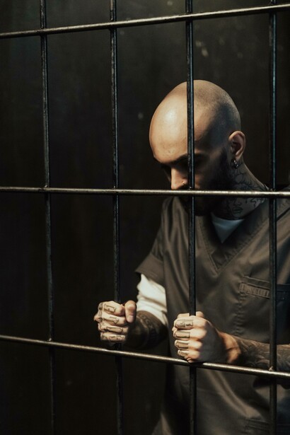 Prisoner gazing down in contemplation