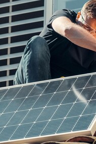 Man installing solar panel