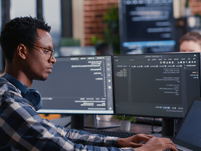 A dedicated IT professional analyses data from quantum simulations, contributing to groundbreaking advancements in fields like drug discovery, materials science, and renewable energy