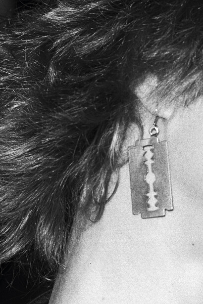 Earring by Gillette, ph by Christopher Makos