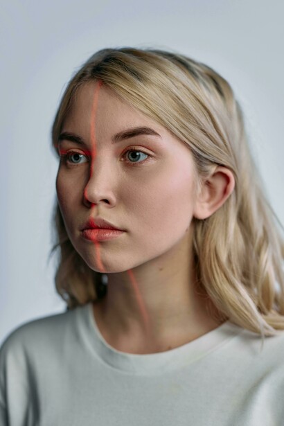 A women exploring the blurred boundaries of identity and AI