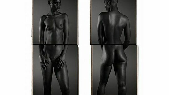 Chuck Close, Bintou I, 2013, black and white Polaroid diptych mounted on aluminum, 56" x 22" (142.2 cm x 55.9 cm), two panels, each. © Chuck Close, courtesy Pace Gallery. Photo courtesy Pace Gallery