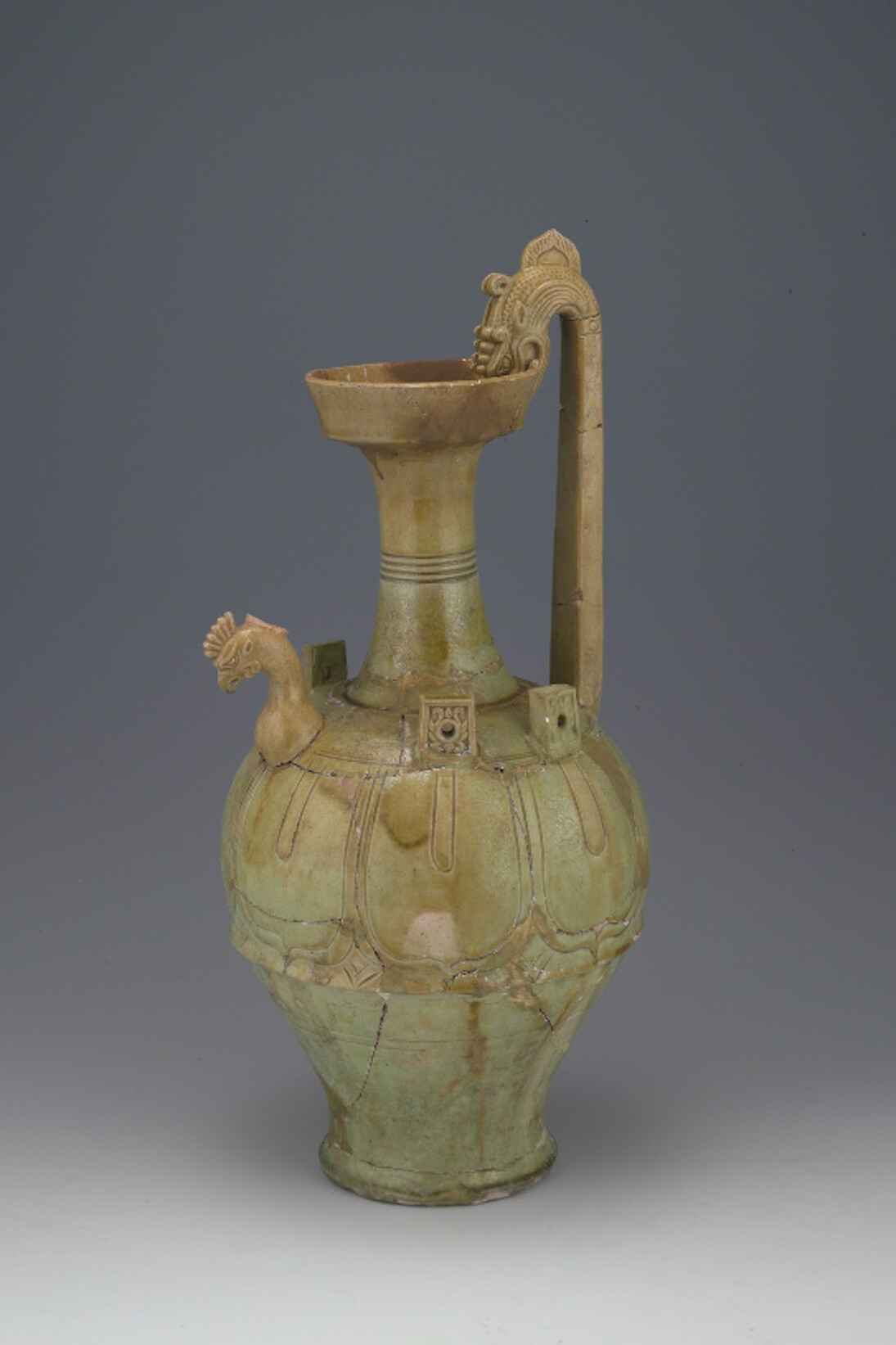 Unknown Artist, Yellow-green glazed ewer with chicken head and dragon hand. Courtesy of China Institute Gallery
