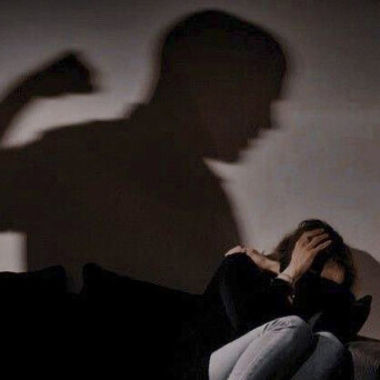 A man showing violence towards a woman
