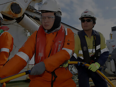 Fugro Discovery crew members heave in on the soft tow cable during the recovery of the Dragon Prince deep tow fish, as Fugro Discovery finishes the first stage of the search for the missing Malaysia Airlines flight MH370