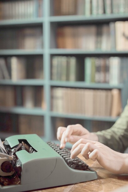 Hands at work on a typewriter