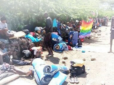 Members of the LGBTQ+ community within the Kakuma refugee camp seeking shelter from the heat