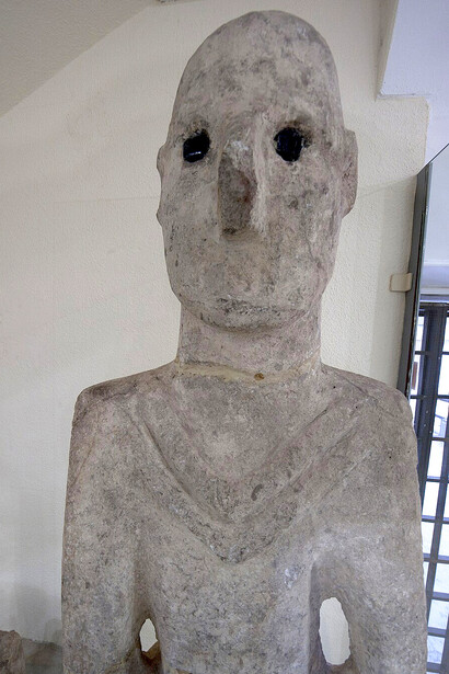 The Urfa Statue, the oldest known life-sized human sculpture to have survived intact, was unearthed in the mid-1990s beneath the Old City of Urfa, just north of Balıklıgöl. It was discovered within a large Pre-Pottery Neolithic settlement, evidenced by the presence of distinctive "terrazzo floors" from Neolithic houses and characteristic flint tools typical of that era, Türkiye