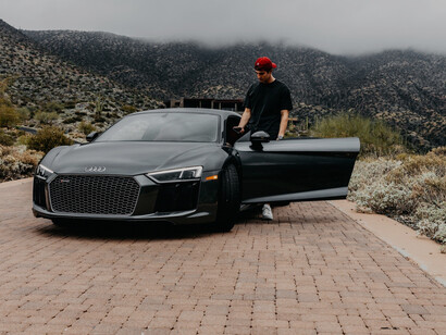 Sebastian Ghiorghiu posing with one of his extravagant cars, Arizona, the USA