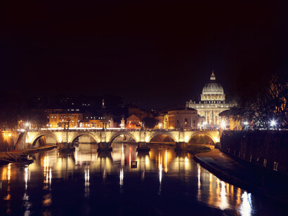St. Peters Basilica near a bridge on the river at night, Rome, Italy