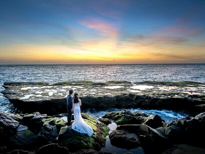 Two lovers admiring the vast expanse of the far sea