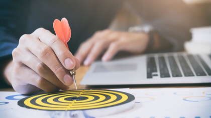 Business strategy success targets and goals illustrated on a dartboard