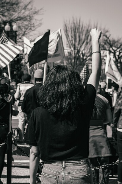 A woman protesting. Social justice is needed to fight poverty and inequality
