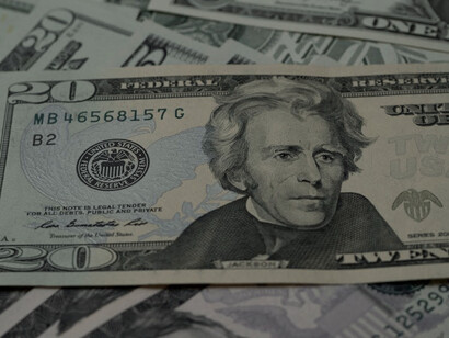 These U.S. dollar bills have been a familiar sight in Congolese markets, representing both purchasing power and the complexities of a bimonetary system