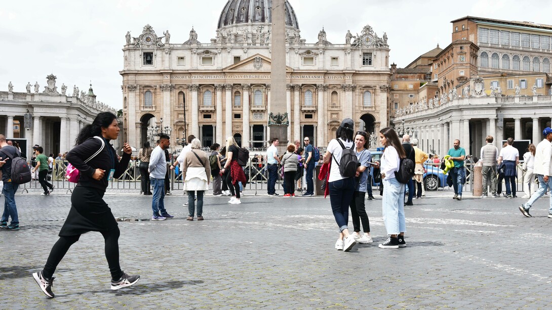 Sara Terracina jogging through Saint Peter's Square, Rome, Italy 

