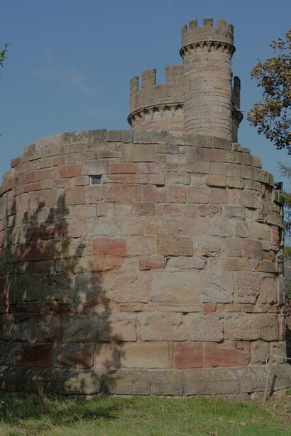 The folly castle in the park of Hagley Hall is a Grade II* listed building and the largest building in Hagley Park, UK