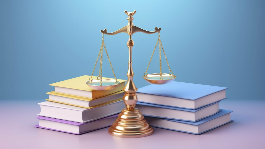 The scales of justice between two piles of books, a representation of the weighing and balancing of legal principles, which is central to the Princonser method