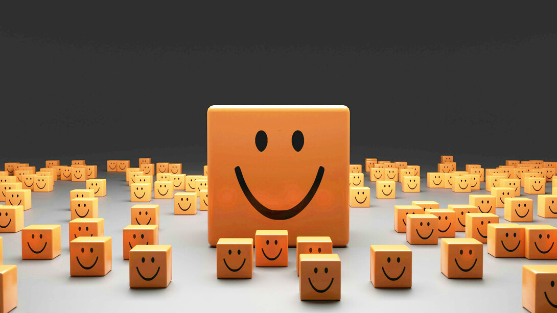 Tiles representing human emotions; emotional analysis of customer's feedback and online engagement is a solid predictor of their buying behavior 