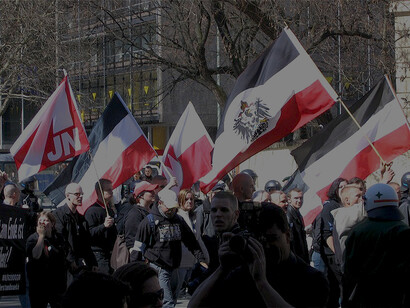 Neo-Nazi march in Munich on April 2, 2005; on the left, a flag of the NPD youth organization, Junge Nationaldemokraten, Germany
