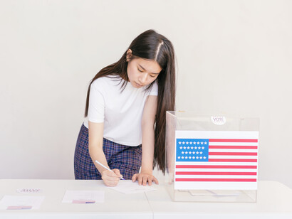 A woman is voting for her candidate in the upcoming elections of the United States