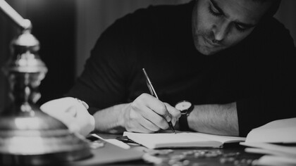 A writer sat at his desk working 
