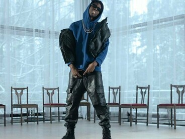 A performer rapping in a vacant studio, representing how creators remix global trends into their own voice