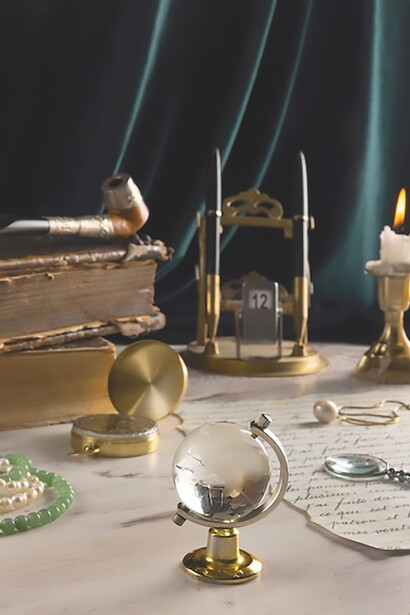 Pirate artifacts elegantly arranged on a rustic table, featuring a vintage map, well-worn combat gear, and a pair of antique binoculars