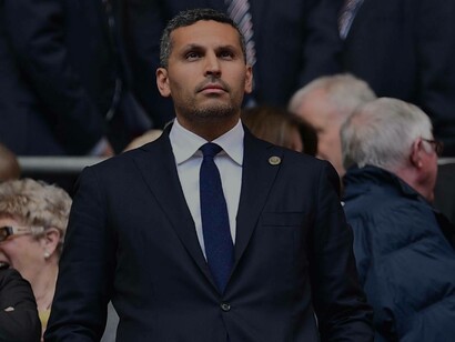 Manchester City chairman Khaldoon Al-Mubarak looking on onto the pitch with a worried expression