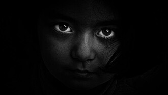 The loss of innocence, the haunting gaze of a child reflects the toll of political unrest