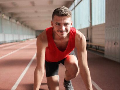 The athlete prepares for takeoff, showcasing the blend of physical prowess and strategic management that characterises today's sporting events