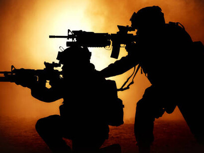 Soldiers silhouette on vibrant orange background