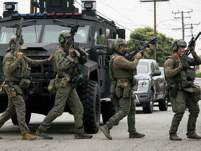 When immigration policy is enforced through combat gear and armored vehicles, democracy itself is under siege