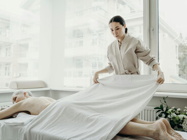 A woman relaxes during a massage therapy session