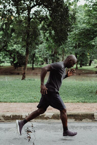 Embarking on his daily run, a man strives to find balance between effort and recovery, the key to sustaining peak performance and health