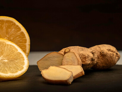 A piece of ginger chopped alongside a lemon, showing how the right pairing can enhance the flavour of a dish as ginger adds a spicy kick while lemon adds brightness and acidity