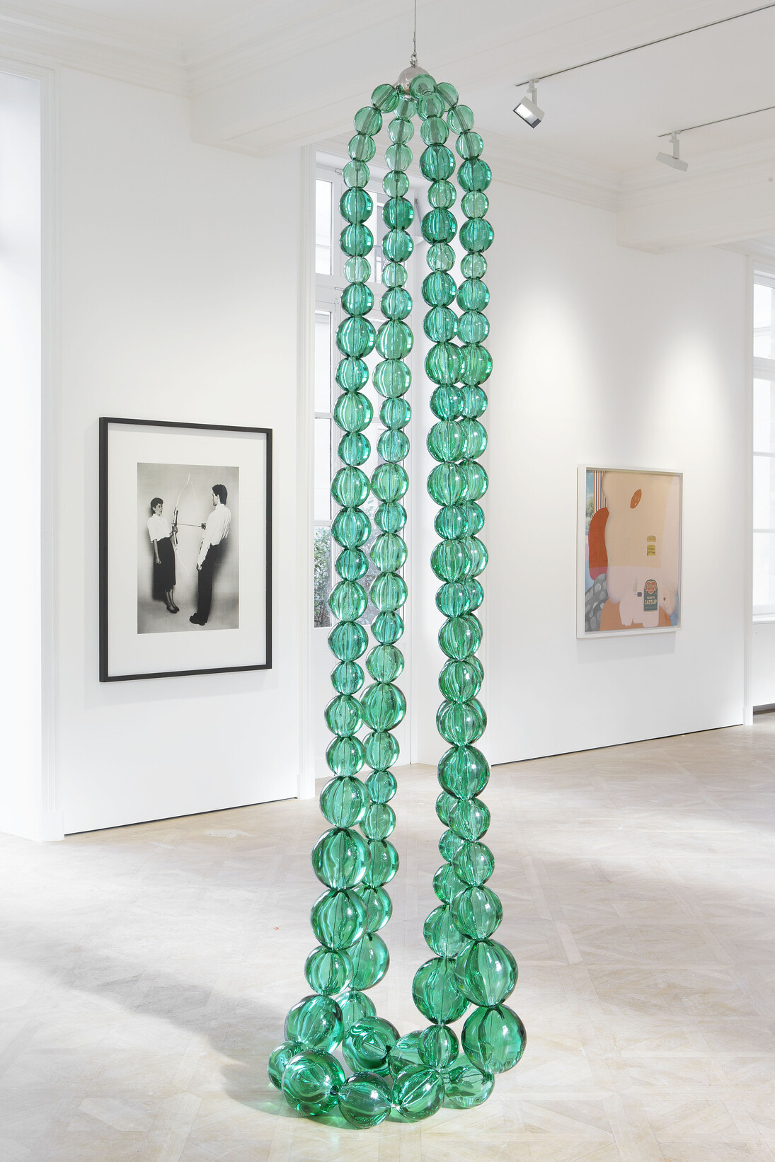 View of the exhibition “G I R L” curated by Pharrell Williams, 27 May – 25 June, 2014, Salle de Bal / Galerie Perrotin, Paris. Jean-Michel Othoniel, "Double Collier Emeraude", Murano glass, stainless steel / Verre de Murano, métal, 130 x 27 1/2 x 17 3/4 inches / 330 x 70 x 45 cm, Photo: Claire Dorn, Courtesy Galerie Perrotin 