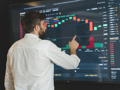 A man tracking the stock market fluctuations