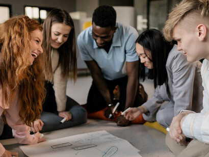 In an office setting, a collective of marketing employees seamlessly collaborates on their tasks and projects