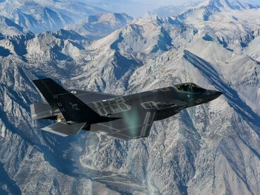 An Lockheed Martin F-35 Lightning II assigned to the Argonauts of Strike Fighter Squadron (VFA) 147 flies in formation during a photo exercise over Lemoore, California, on Nov. 16, 2018