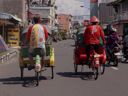 In Solo, the streets never sleep, with tuk-tuks, motorcycles, and pedestrians weaving between the colourful stalls of markets, creating a dynamic blend of life and culture
