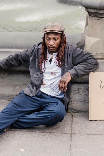 Homeless man with a sign