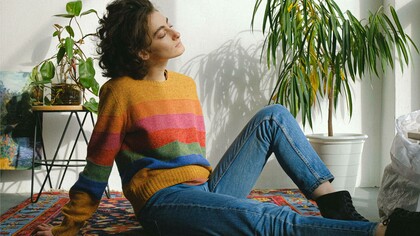 A woman relaxing as she draws inspiration for her next creative project