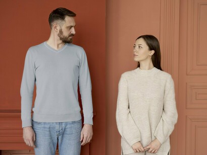 A man and woman pausing to acknowledge one another after conflict, symbolising the balance between emotional honesty and self-respect