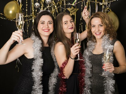 Sparkling party guests with champagne flutes, symbolising the spectacle that often blurs the line between fantasy and reality