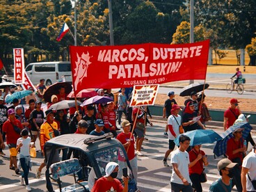 Protesters carrying bold calls for justice during a peaceful demonstration, symbolising the growing frustration of Filipinos seeking transparent and accountable governance