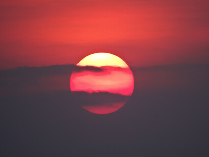 A beautiful red sun sets