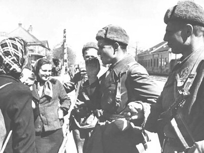 Soviet soldiers in WW2 interacting with the local women in Austria