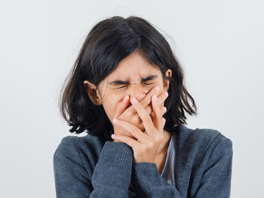 Behind her hands lies a story of pain, a reminder that small acts of kindness can make a significant difference in someone’s life